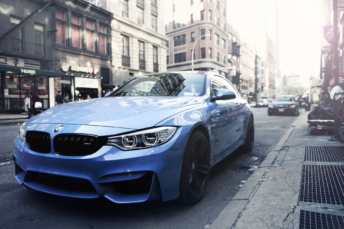 Blue BMW on City Street