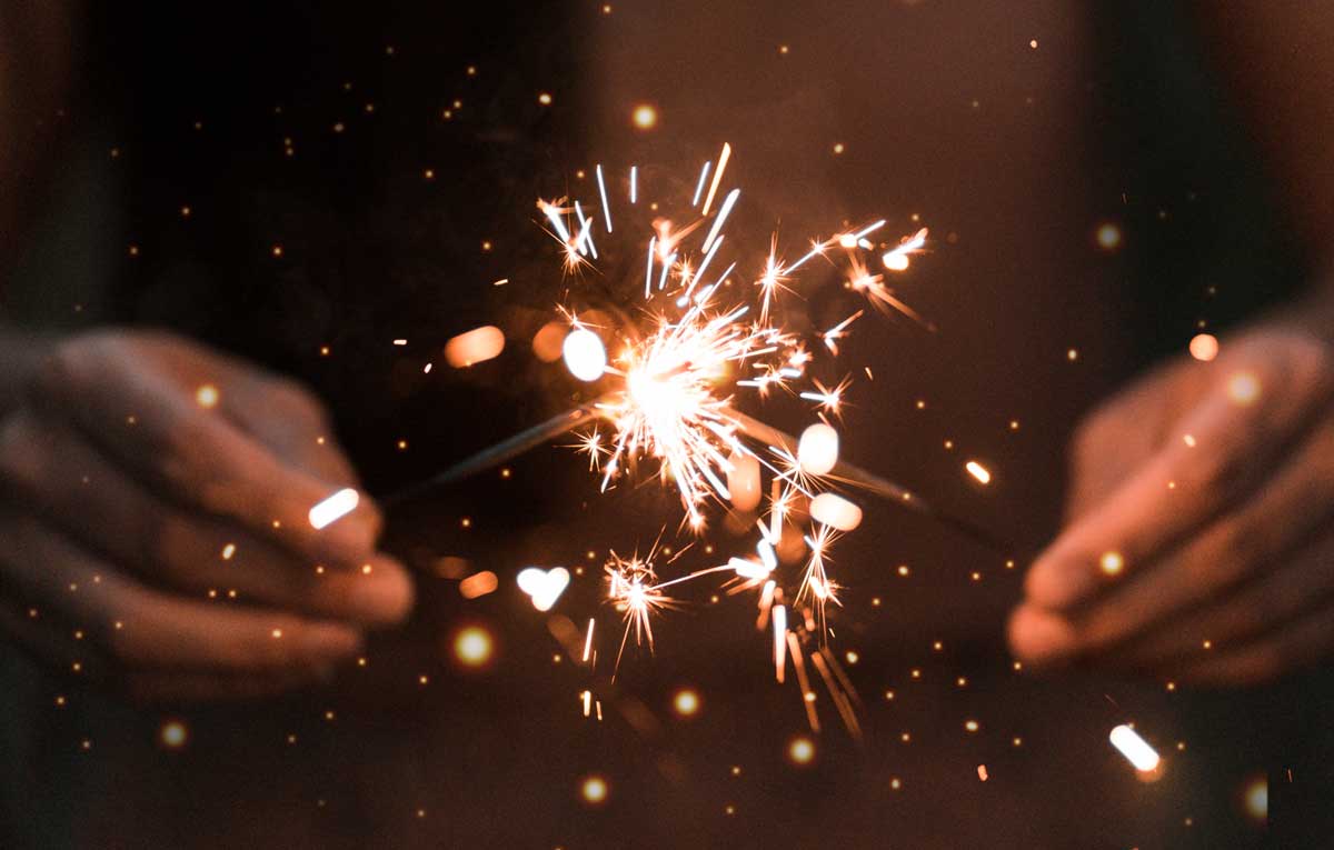 A Person Holding Sparklers Happy New Year